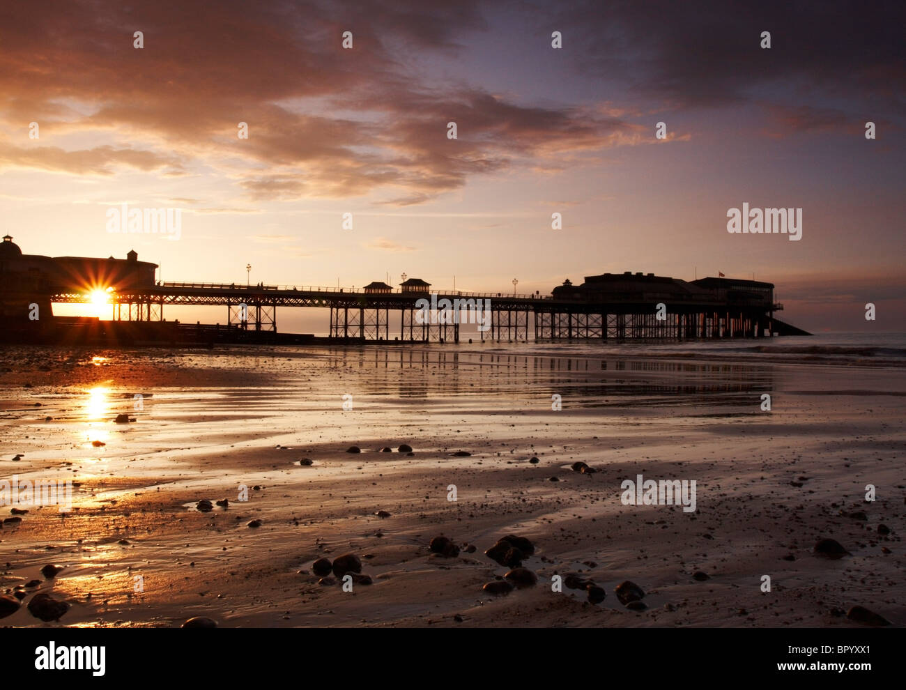 Cromer Pier al tramonto Foto Stock