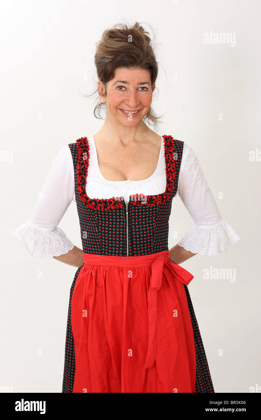 Donna di mezza età che indossa un vestito con grembiule, abito tradizionale Foto Stock