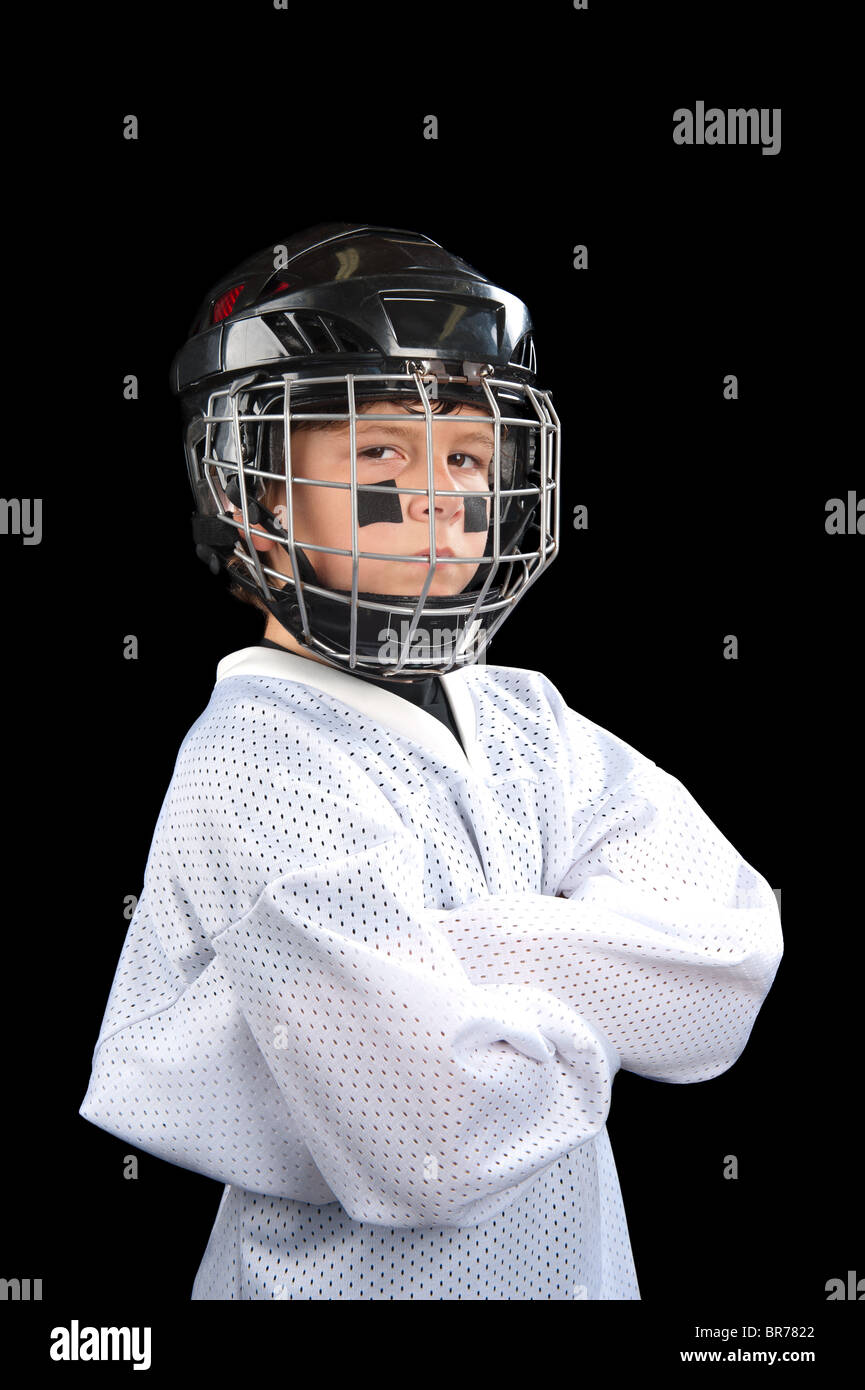 Un giovane giocatore di hockey in posa con atteggiamento. Foto Stock