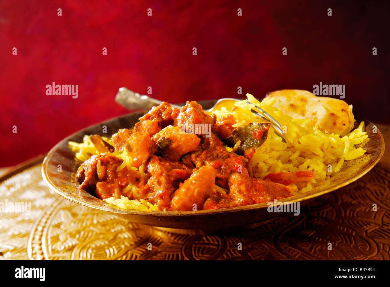 Tradizionale Indiano curry di agnello con riso pilaf Foto Stock
