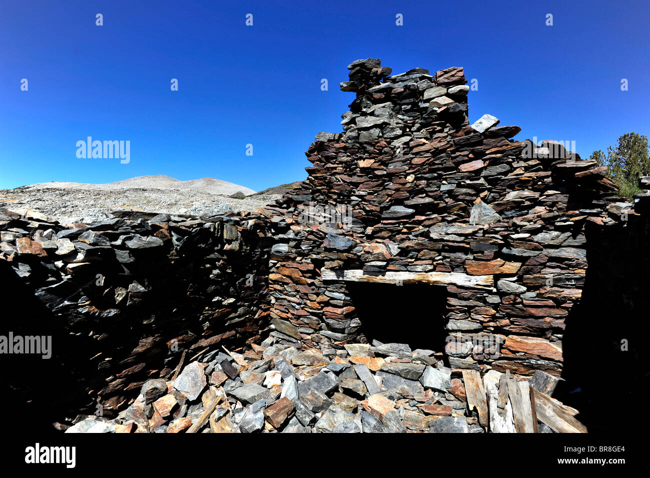 Vecchi minatori cottage camino in pietra Foto Stock