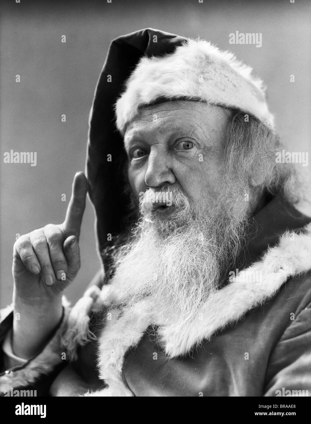 1930s ritratto di Babbo Natale di puntare il dito IN ALLARME Foto Stock