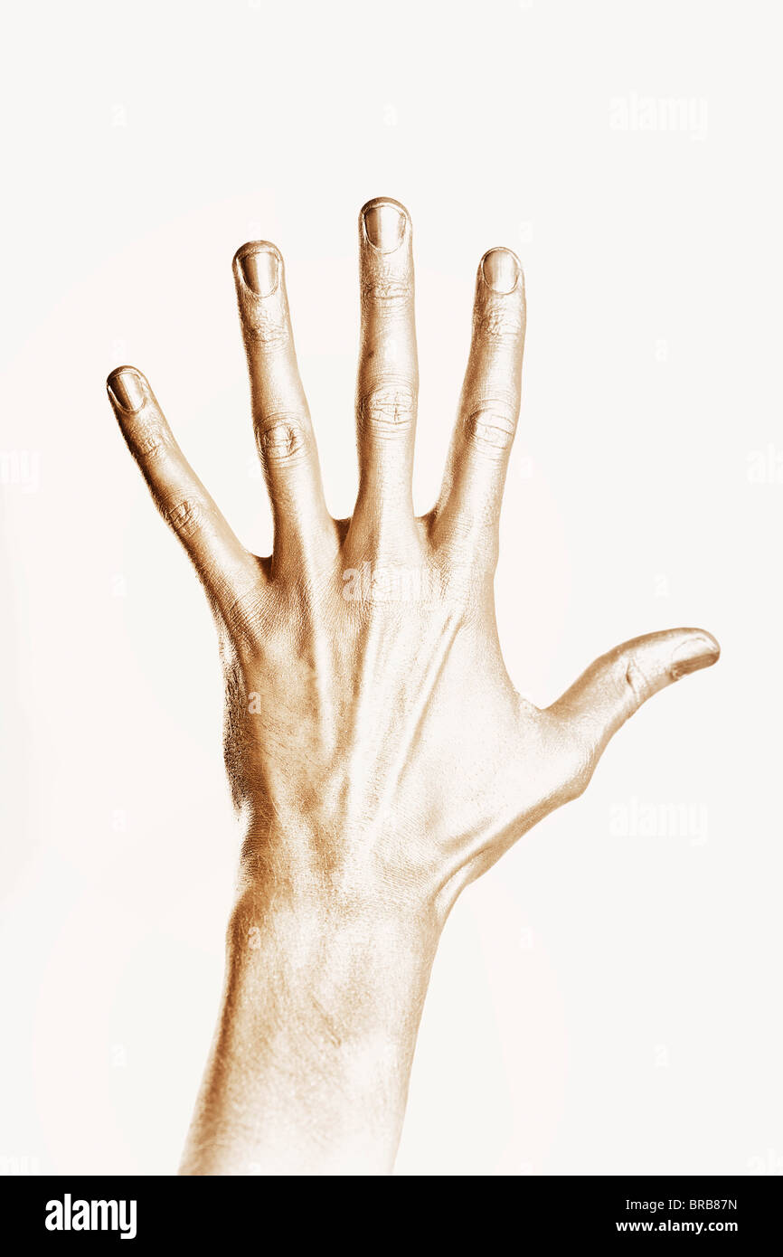 Bella Mano d'uomo in oro dipingere isolati su sfondo bianco Foto Stock