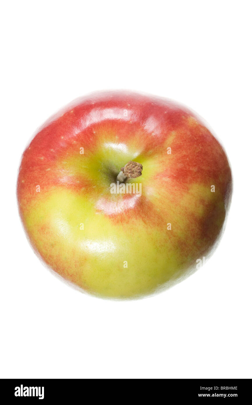 Una mela su sfondo bianco Foto Stock