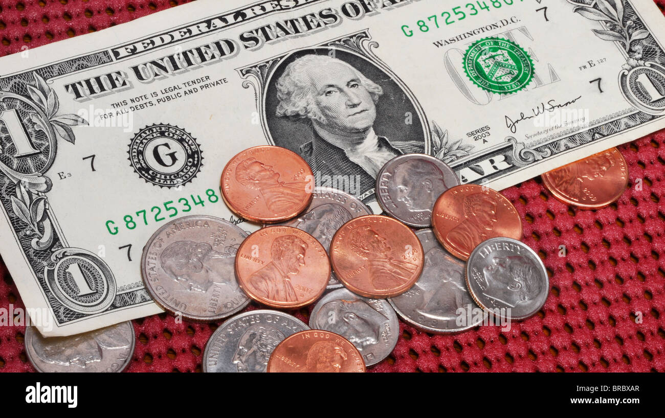 I soldi per una punta. Un dollaro e alcuni cambiamenti. Foto Stock