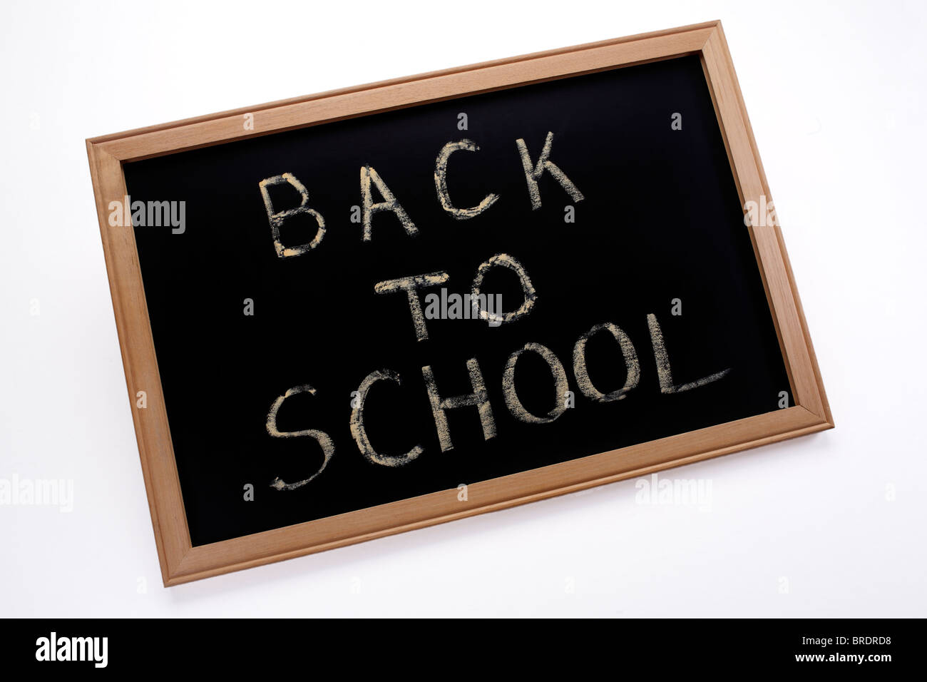 Si torna a scuola scritto in gesso su lavagna ardesia Foto stock - Alamy