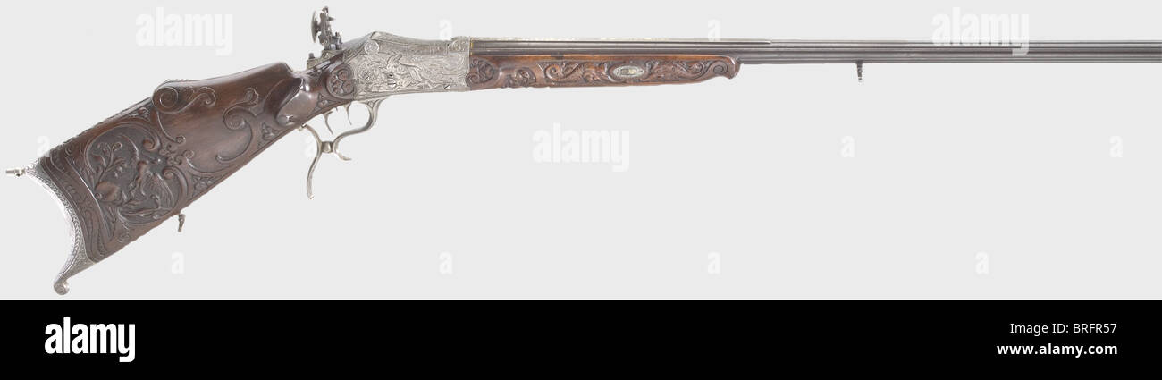 Un fucile di destinazione a caricamento di Breech splendido, Martini action.C.Stiegele,Munich,circa 1880.Caliber 8.15 x 46 R,number 33.Round con un avvistamento piatto e sei costole circostanti.Bore luminoso.la firma,'G.Stiegele jun.München' è intarsiata in oro sulla parte superiore del barile, e vi è sontuosa oro e argento intarabesco intarsiato sul ricettio Con scene di caccia nel tedesco rinascimentale legno stile.set trigger.apertura micrometrica regolabile Sight.Noce stock con ornamenti profondamente scolpiti.incisa furn di ferro, diritti aggiuntivi-clearences-non disponibile Foto Stock Un fucile di destinazione a caricamento di Breech splendido, Martini action.C.Stiegele,Munich,circa 1880.Caliber 8.15 x 46 R,number 33.Round con un avvistamento piatto e sei costole circostanti.Bore luminoso.la firma,'G.Stiegele jun.München' è intarsiata in oro sulla parte superiore del barile, e vi è sontuosa oro e argento intarabesco intarsiato sul ricettio Con scene di caccia nel tedesco rinascimentale legno stile.set trigger.apertura micrometrica regolabile Sight.Noce stock con ornamenti profondamente scolpiti.incisa furn di ferro, diritti aggiuntivi-clearences-non disponibile Foto Stock