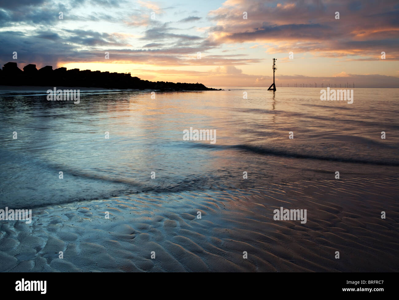 Tramonto, nuova spiaggia di Brighton, Wirral Peninsula Foto Stock