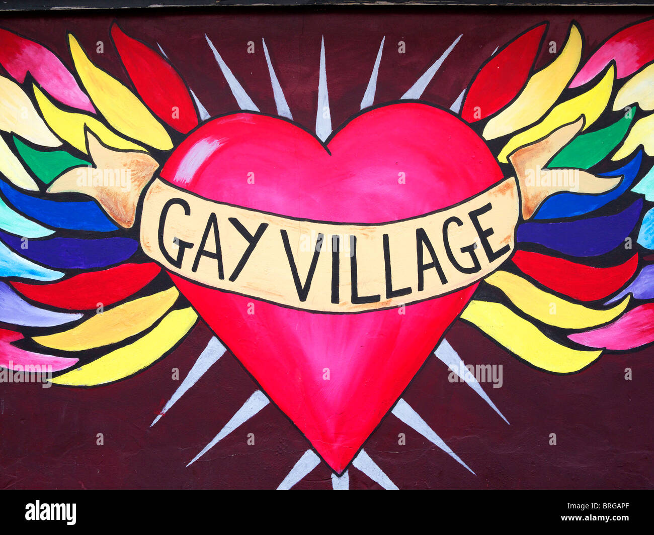 Gay Village segno dipinta su un muro di mattoni vicino Hurst Street parte della città gay area Birmingham REGNO UNITO Foto Stock