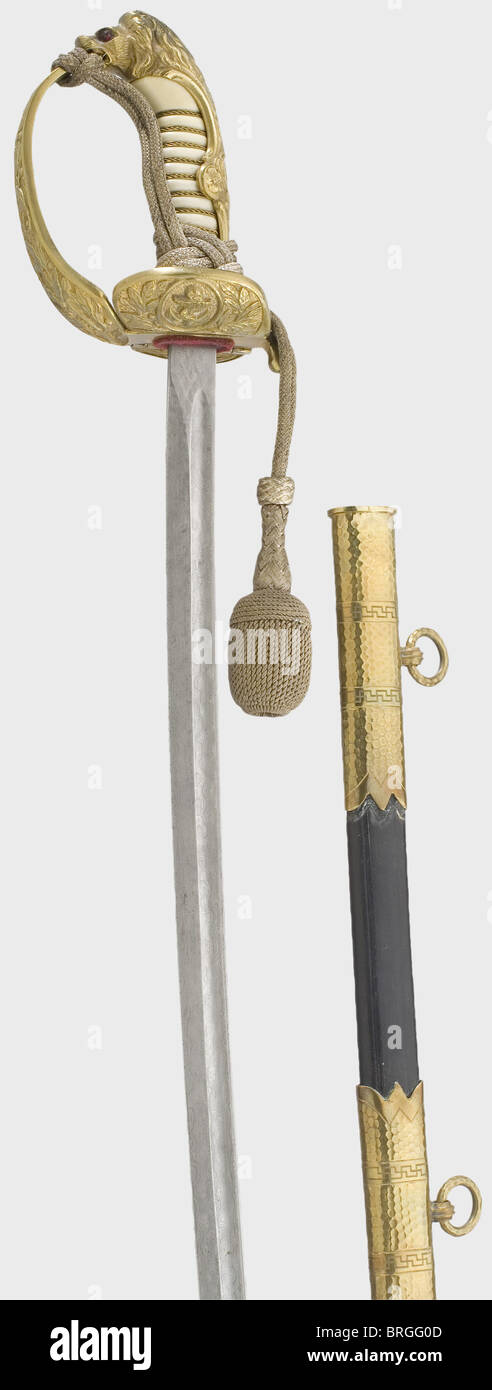 Una sciabola testa di leone fine con lama di Damasco rosa, per un ufficiale navale la lama monorotata con un punto a doppio bordo è di Damasco rosa splendidamente forgiato.il pomo testa di leone con occhi di vetro rosso e verde inset, ha resti di doratura e rilievo alloro decoration.White grip in plastica con filo di ottone wiring.Folding guard plate, il Obverse con un ancoraggio fouled,il retro si blocca nello scabbard.Black pelle scabbard con tre supporti martellato in ottone,ciascuno dei quali porta due strisce swastikas lavorato in martello engraving.Complete con spada nodo.L,Additional-Rights-Clearences-non disponibile Foto Stock