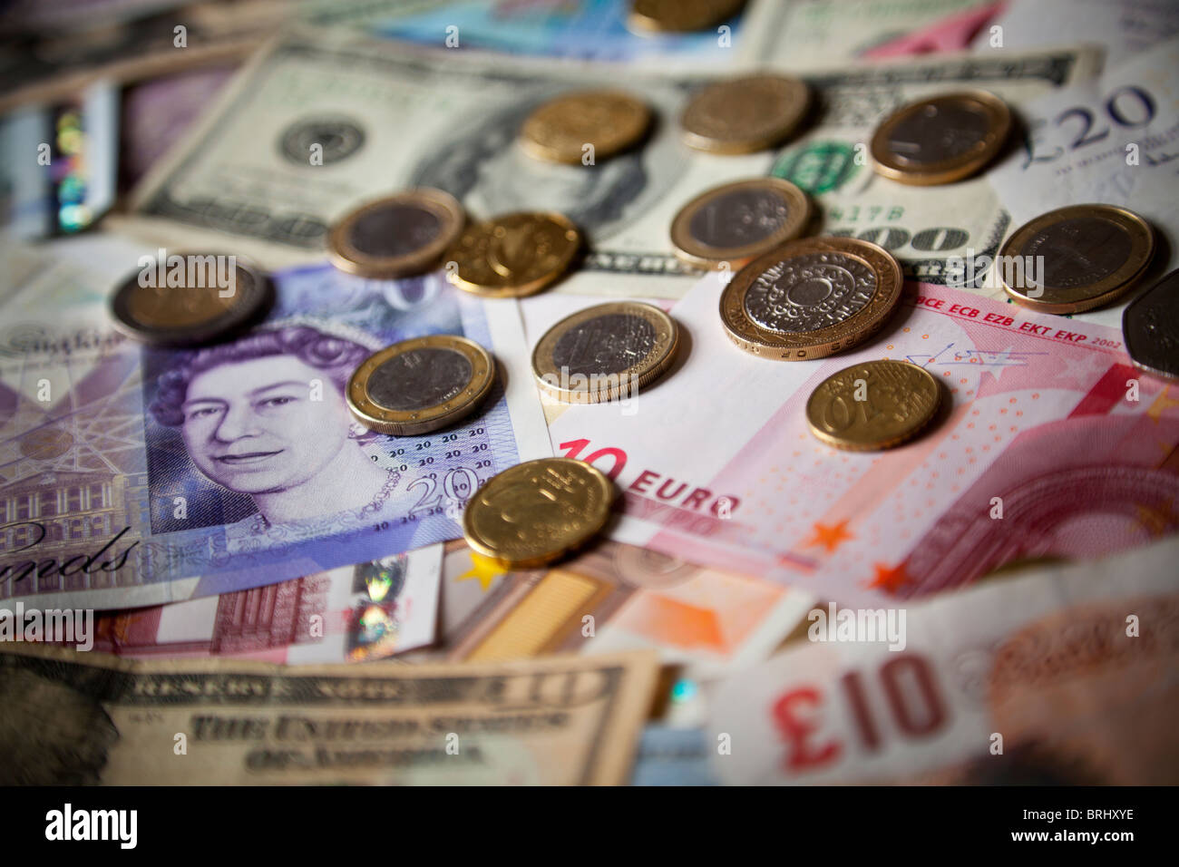 Sterlina, il dollaro e le banconote e monete in euro Foto Stock