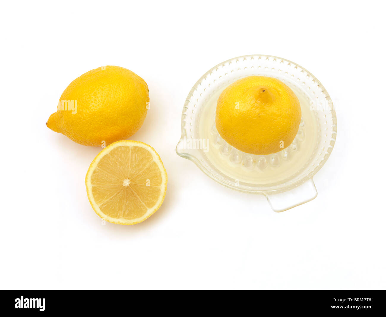 I limoni e il succo di limone In Centrifuga Foto Stock