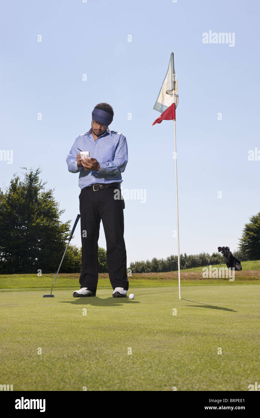 Scrivere il punteggio su un campo da golf Foto Stock