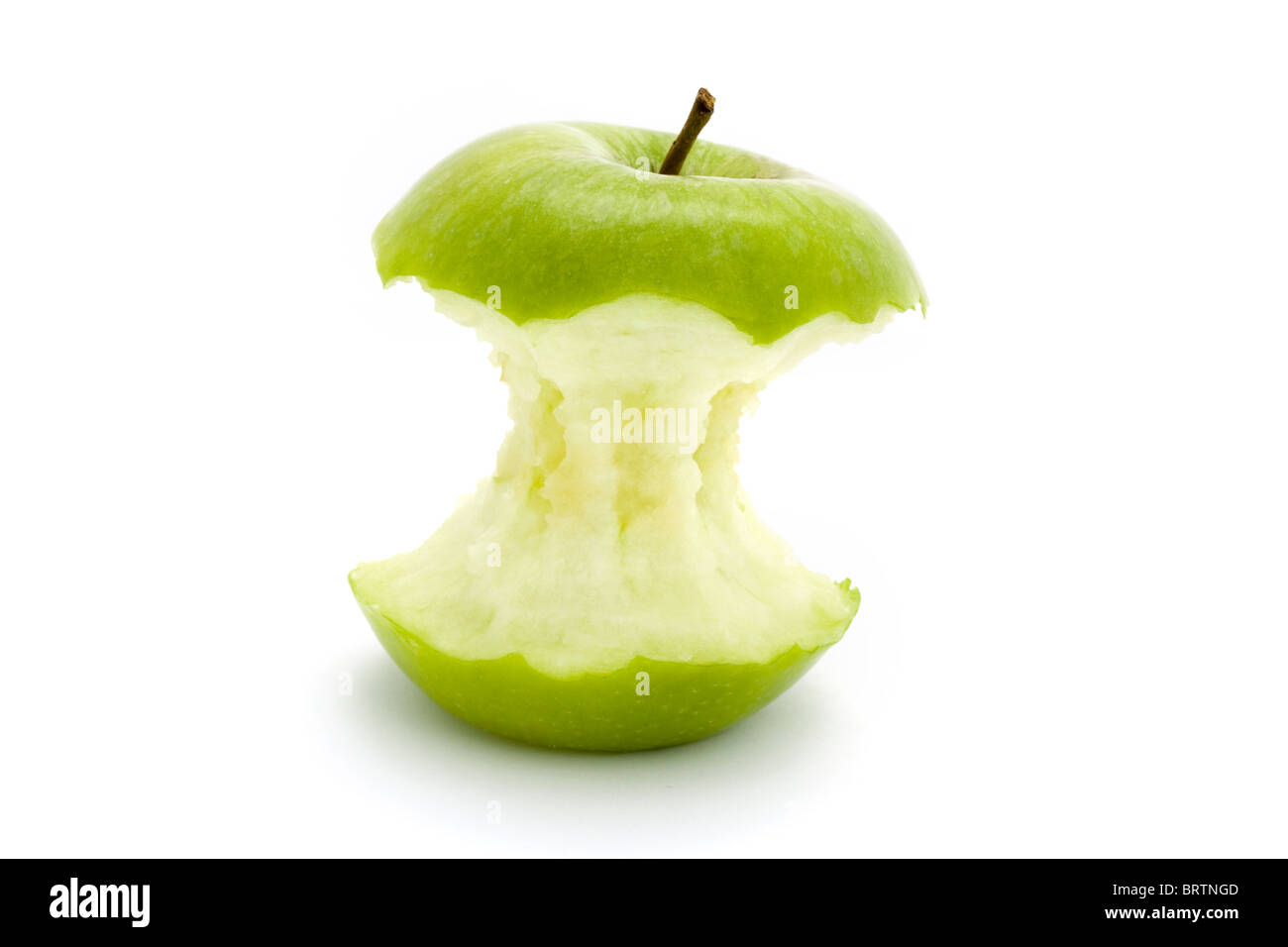 Green apple core isolato su bianco Foto Stock