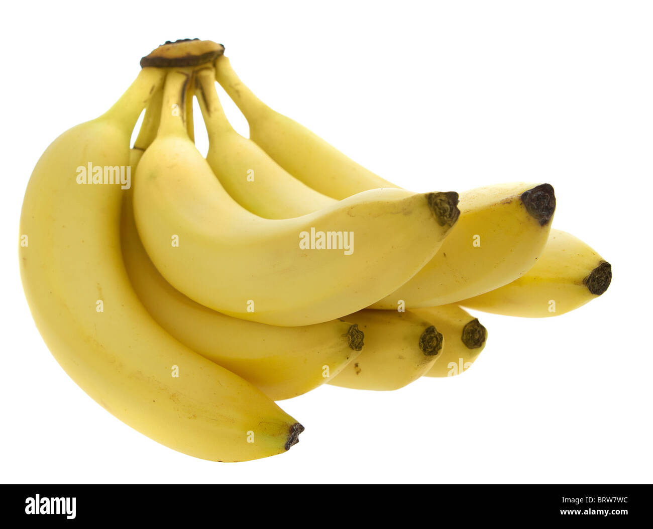 Un mazzetto di banane giallo su bianco Foto Stock