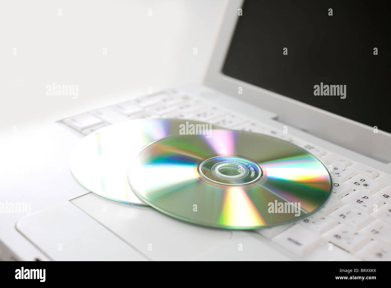 Laptop e CD Foto Stock
