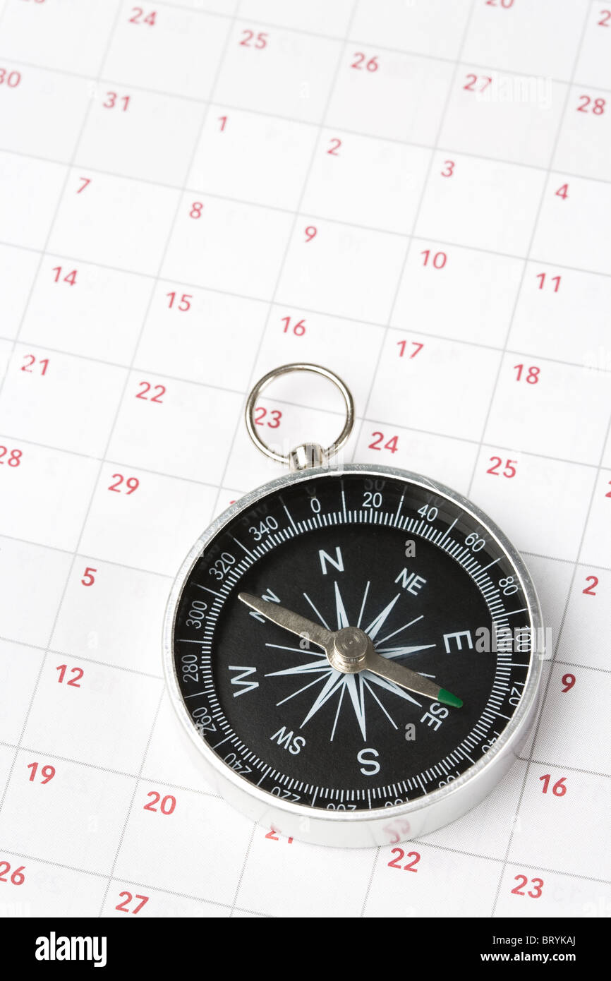 Il calendario e la bussola, concetto di pianificazione del tempo Foto Stock