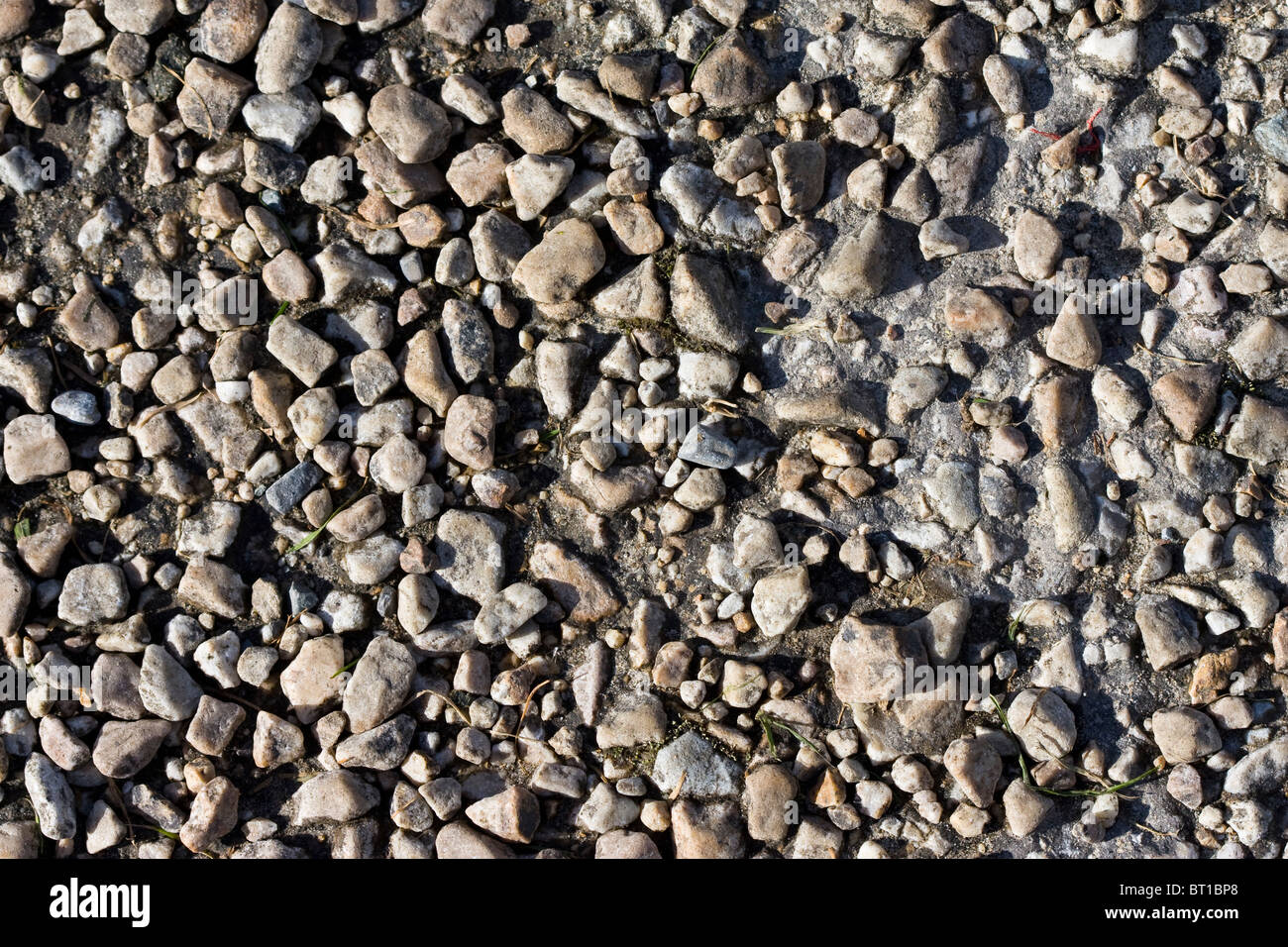 Chiudere l immagine della vecchia strada con piccole pietre Foto Stock