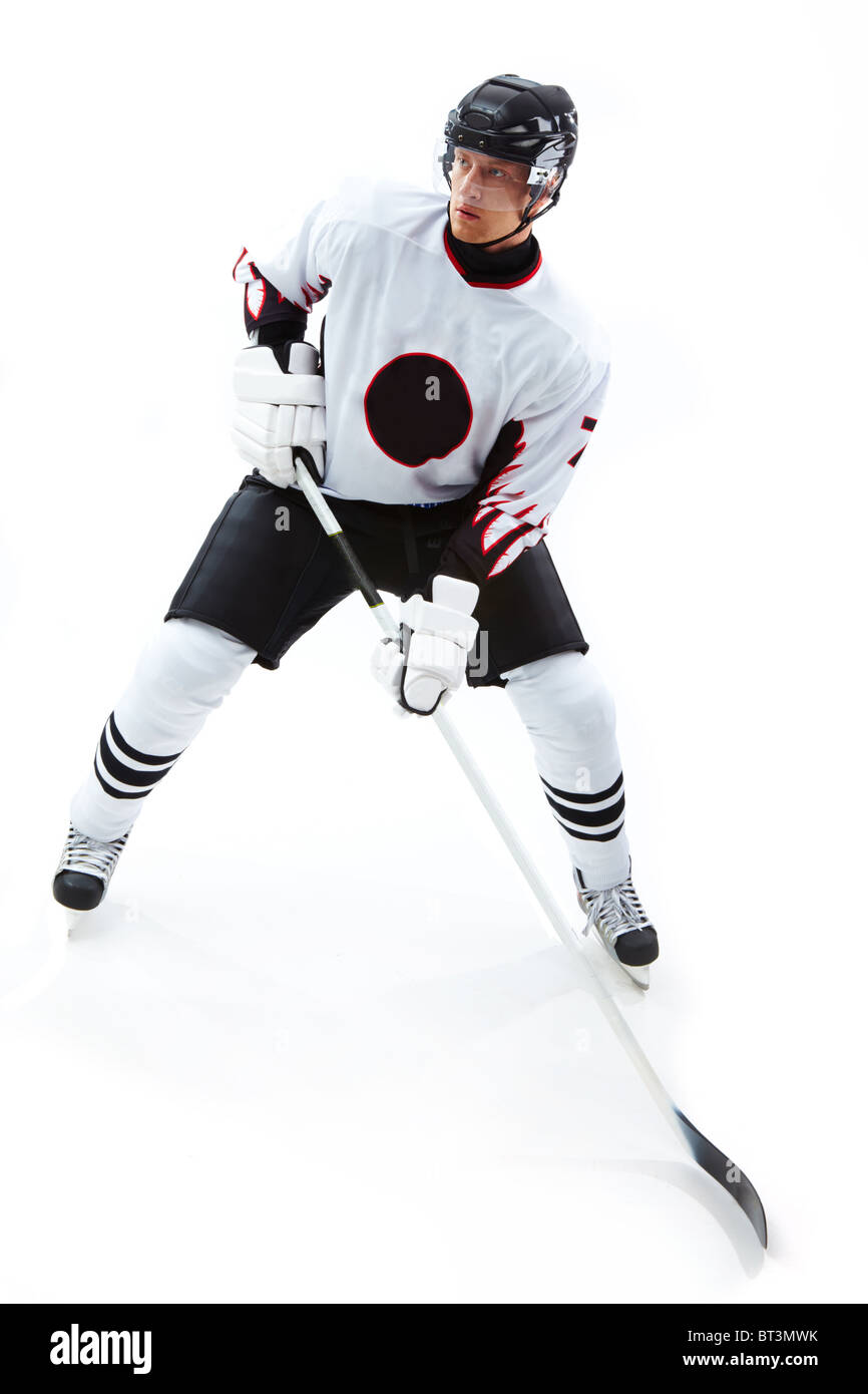 Immagine di concentrato di giocatore di hockey durante le fasi di gioco Foto Stock