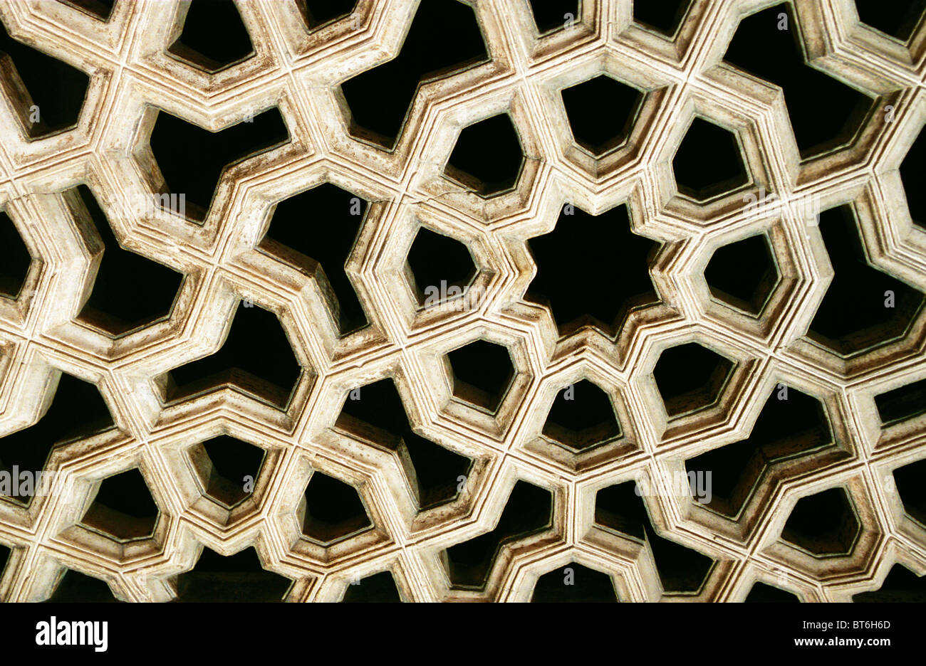 Indian modello geometrico closeup di marmo scolpito sul pannello dettagli nel tempio. Foto Stock