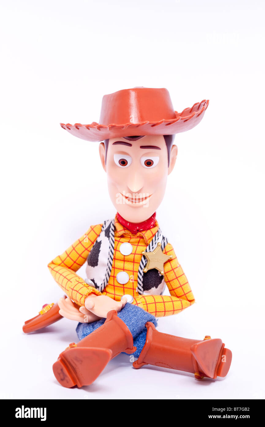 Un vicino la foto di un bambino giocattolo Woody carattere dalla Toy Story film contro uno sfondo bianco Foto Stock