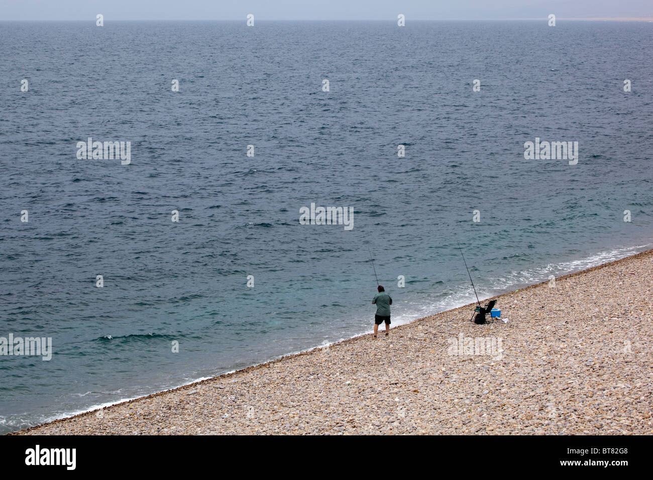 Pesca al largo Chesil Beach Foto Stock