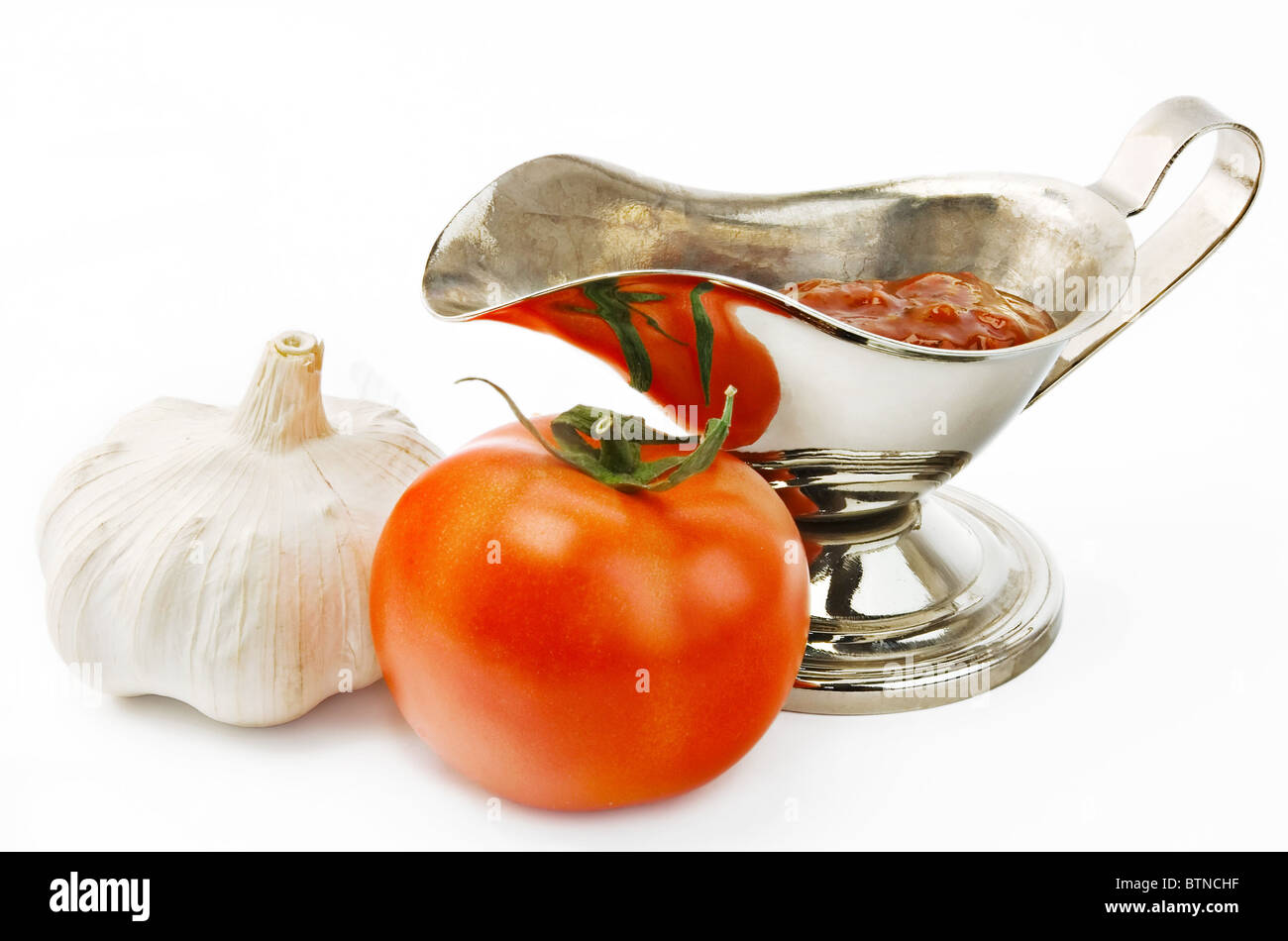 Ketchup in pentola, aglio e pomodoro Foto Stock