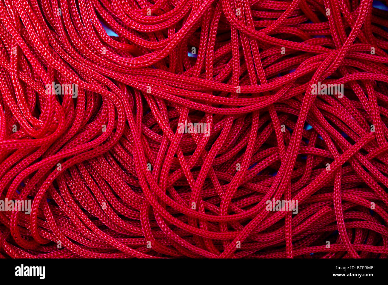 Tessitura di filo rosso sfondo Foto Stock