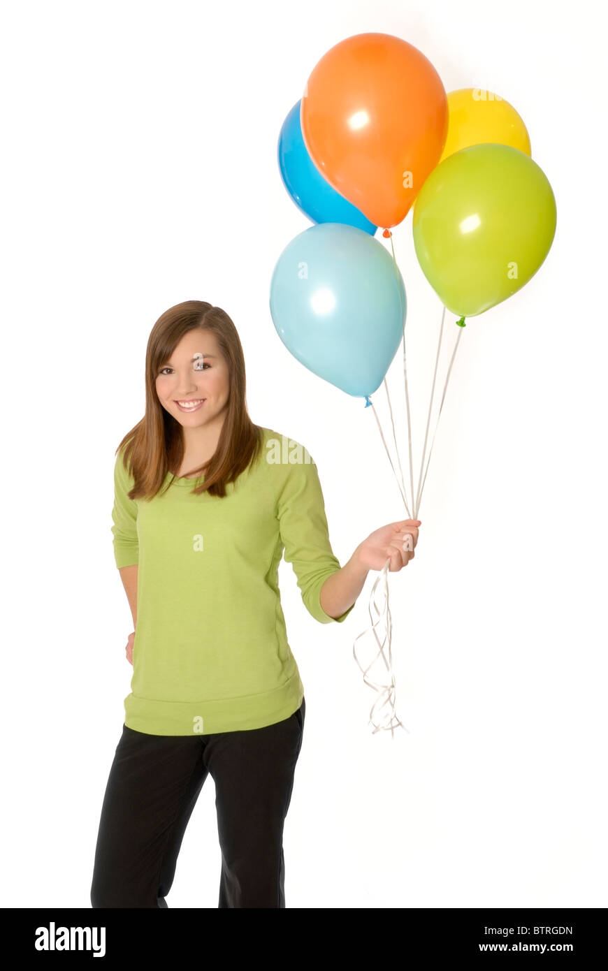 Ragazza adolescente holding palloncini. Foto Stock