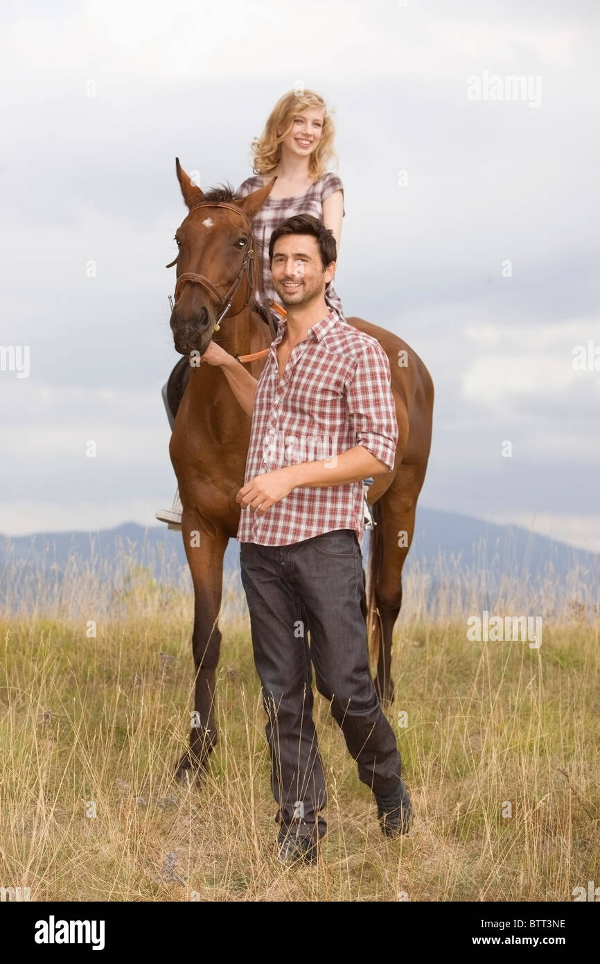 Persone e cavalli Foto Stock