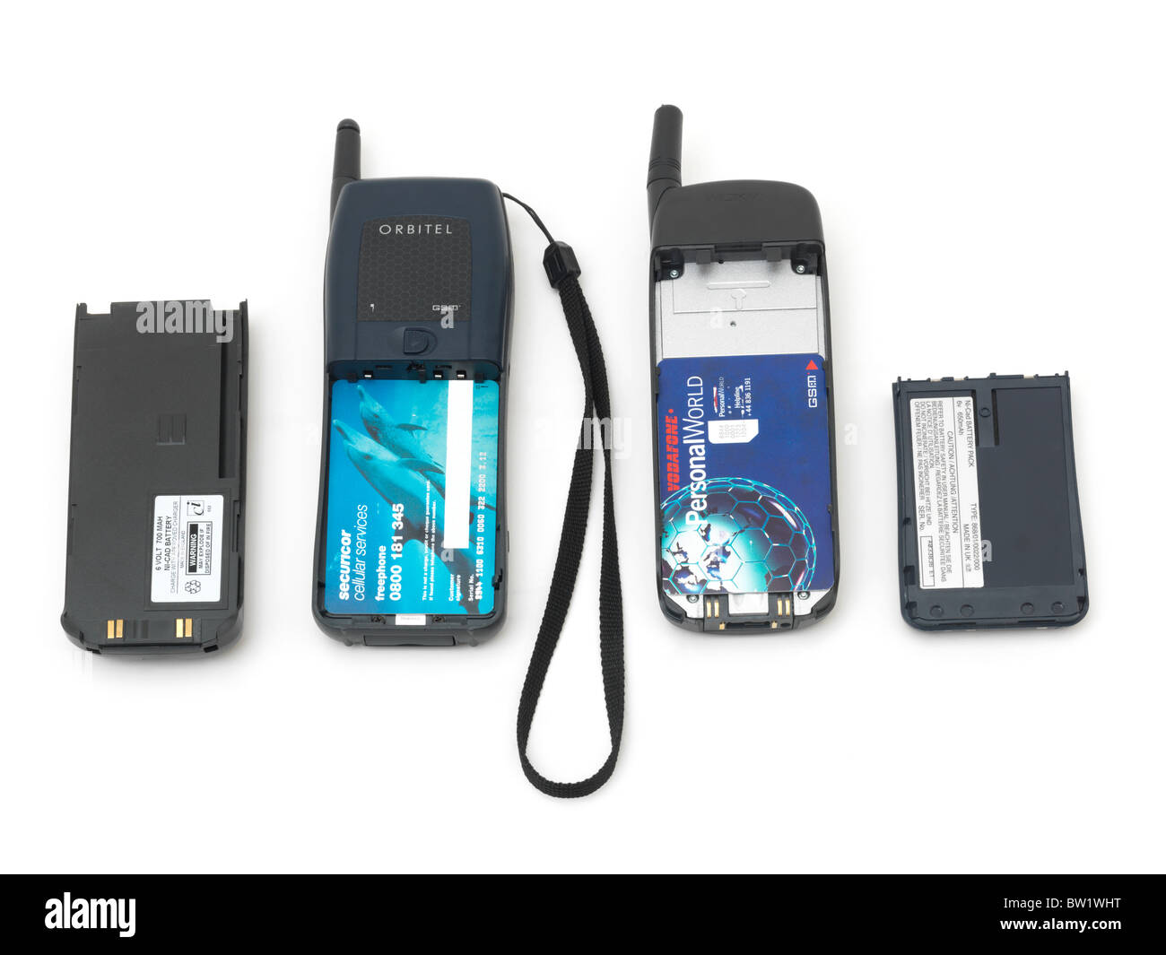 Vecchi cellulari che mostra le schede SIM e batterie Foto Stock