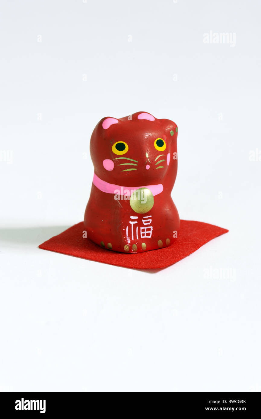 Gatto rosso, LUCKY RED CAT, Maneki Neko, giapponese, indicandovi CAT, INVITANDO CAT Foto Stock