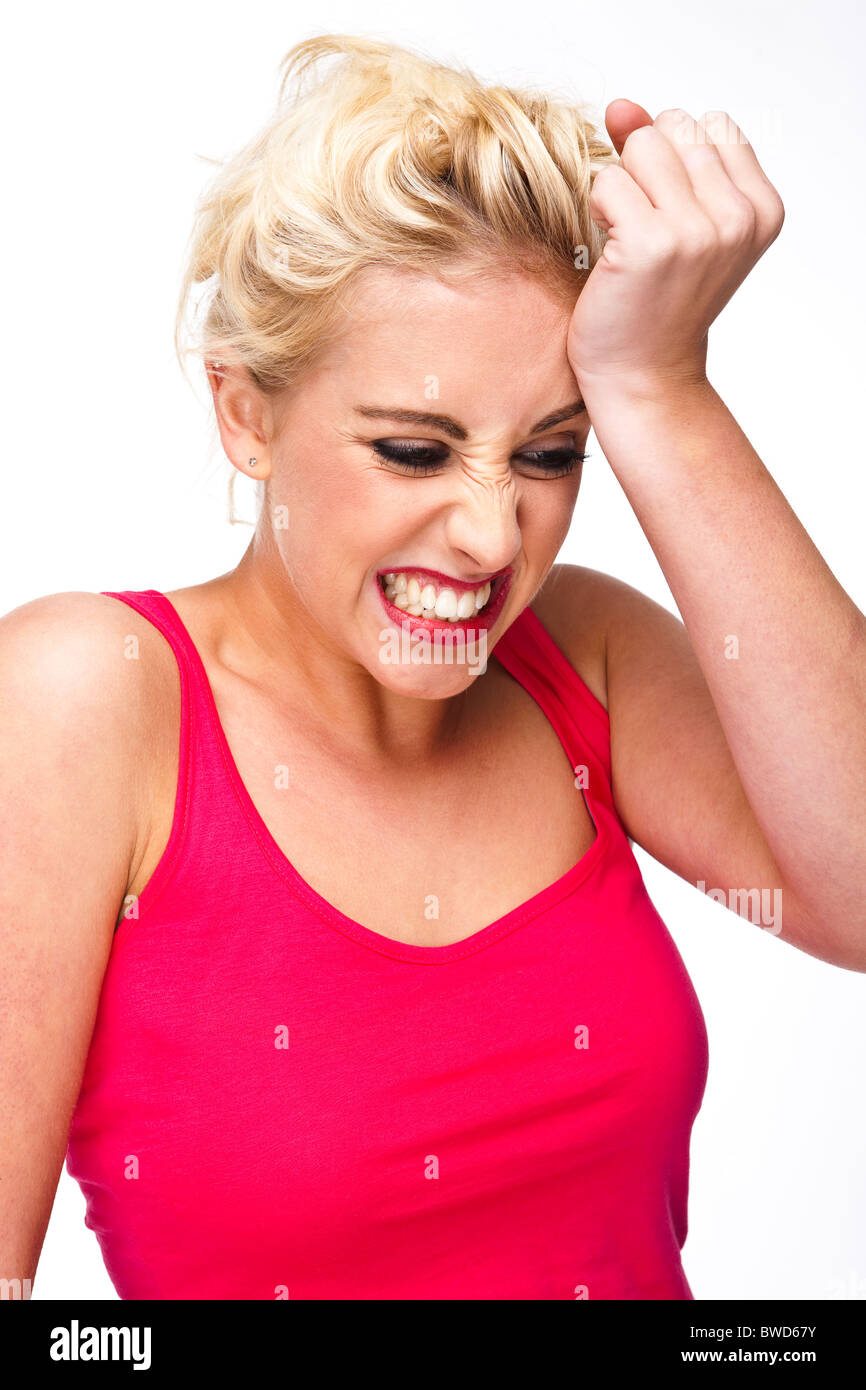 Errore, lo stress, la preoccupazione, la stupidità - giovane e bella donna bionda con la mano alla testa Foto Stock