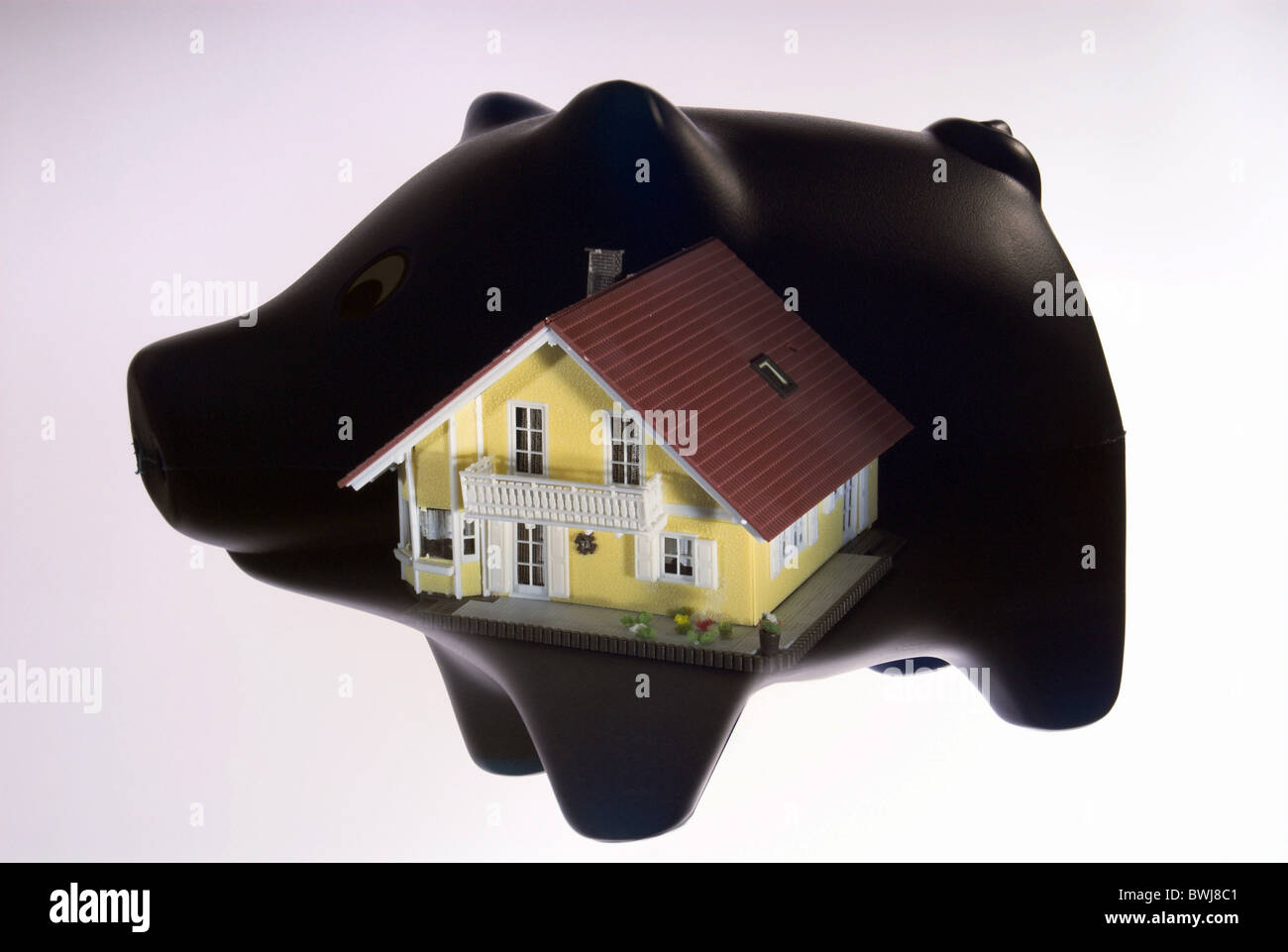 Maiale salvadanaio salvataggio di casa propria home home casa unifamiliare futuro vivendo immobiliare finanzia il denaro Foto Stock