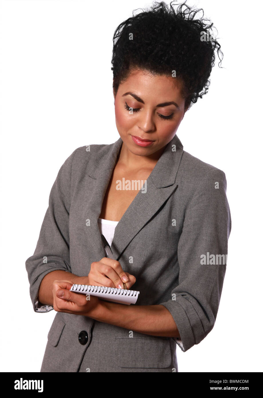 Giovani, mixed-gara, business donna prendendo appunti Foto Stock