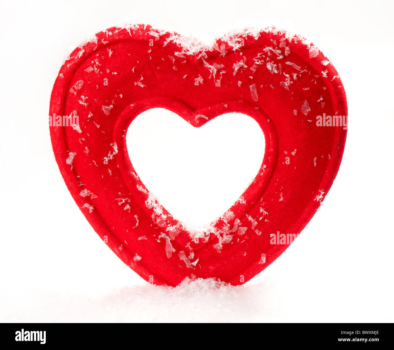Cuore artificiale nella neve Foto Stock