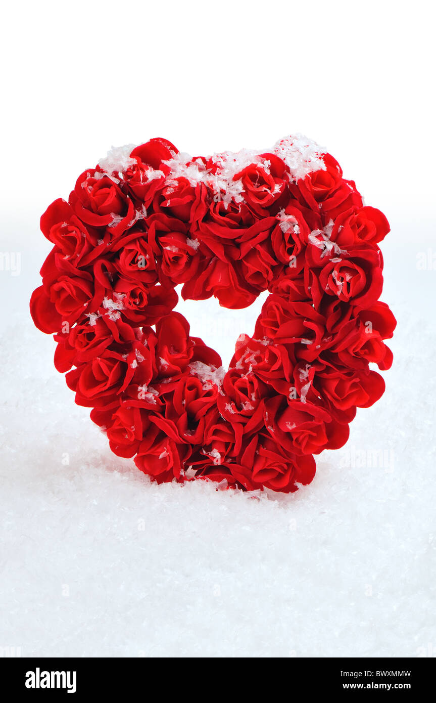Rosso cuore di pietra di neve artificiale Foto Stock