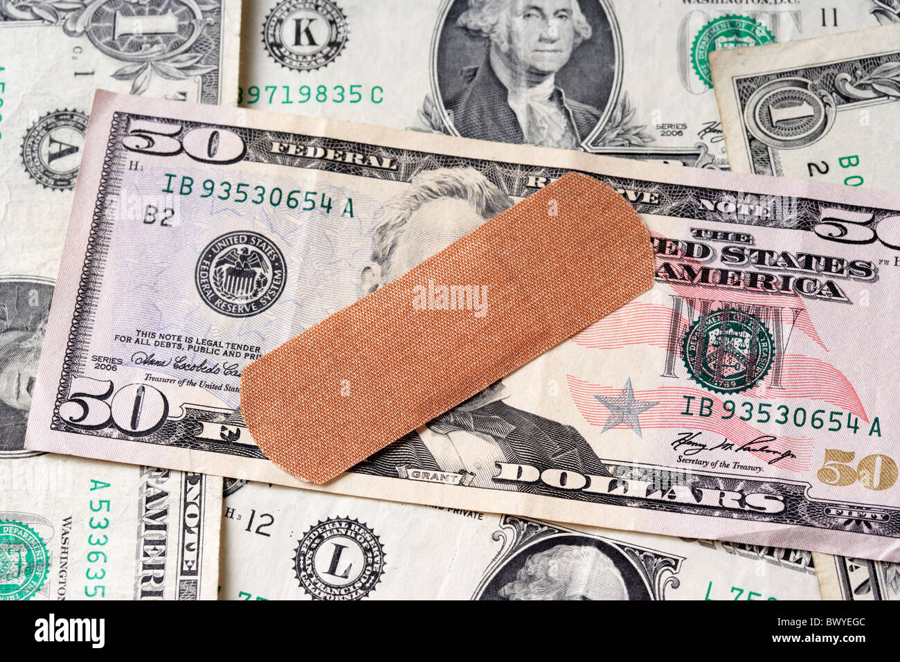 Cerotto sul dollaro Usa banconote Foto Stock