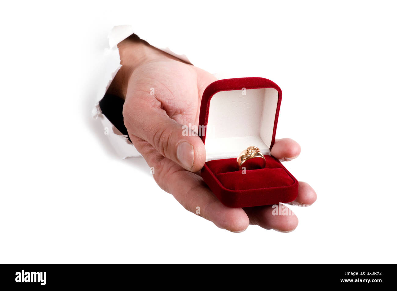 Oggetto su bianco - anello d'oro per la mano Foto Stock