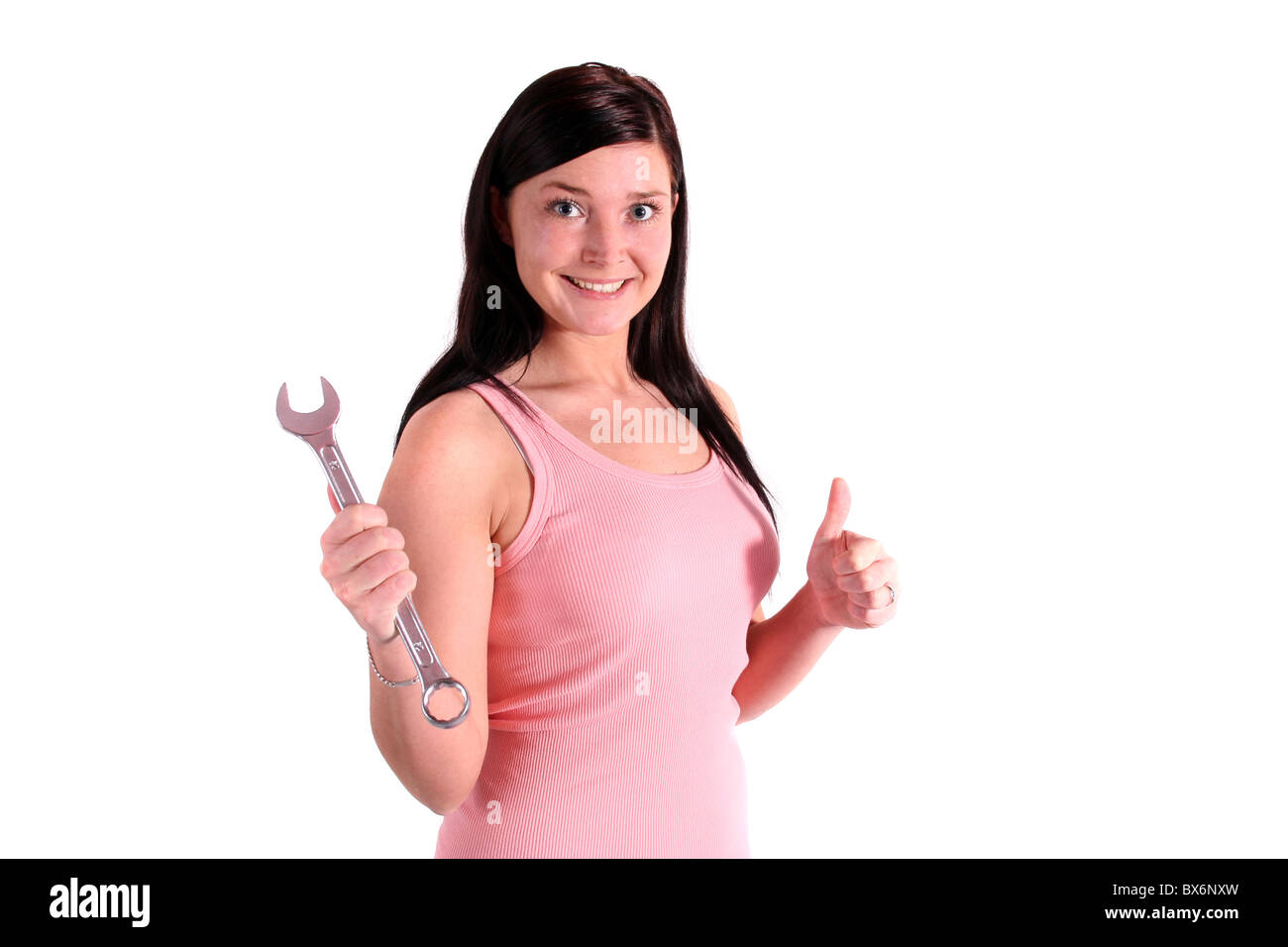 Una bella donna sorridente tenendo una vite-chiave. Tutti gli isolati su sfondo bianco. Foto Stock