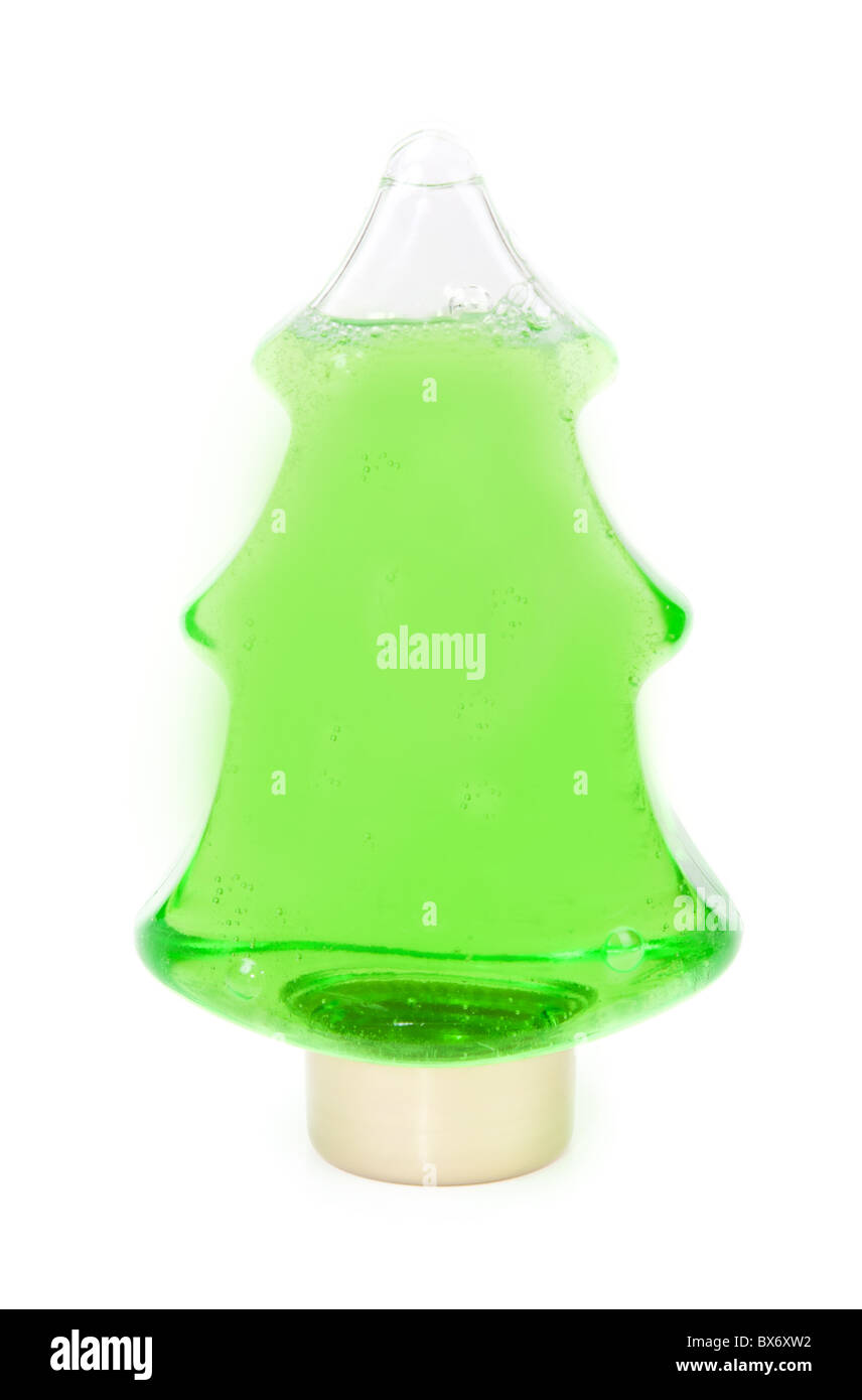 Shampoo verde in una bottiglia a forma di albero di Natale Foto Stock