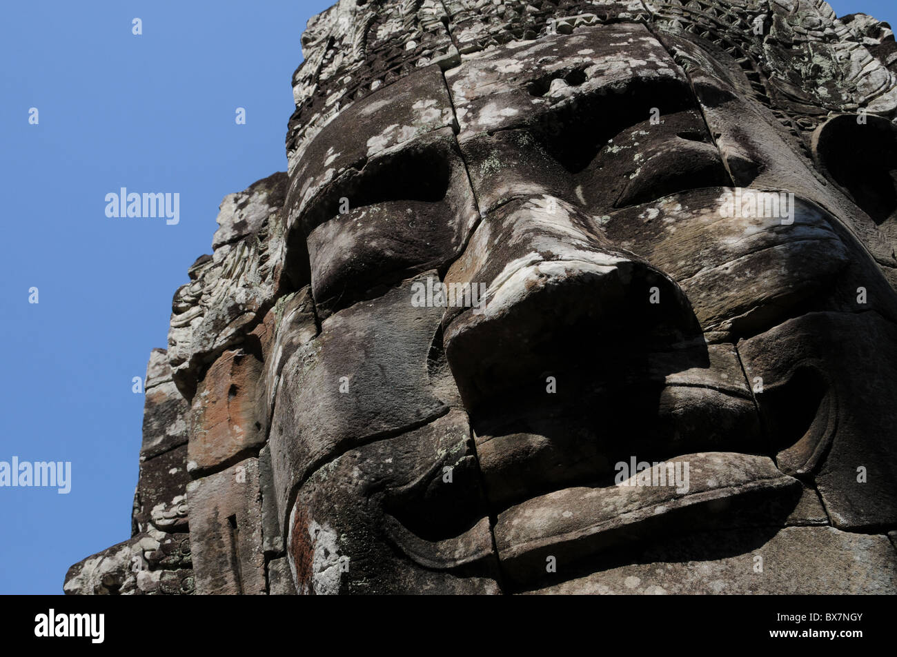 Faccia del Lokeshvara al tempio Bayon in Angkor Foto Stock