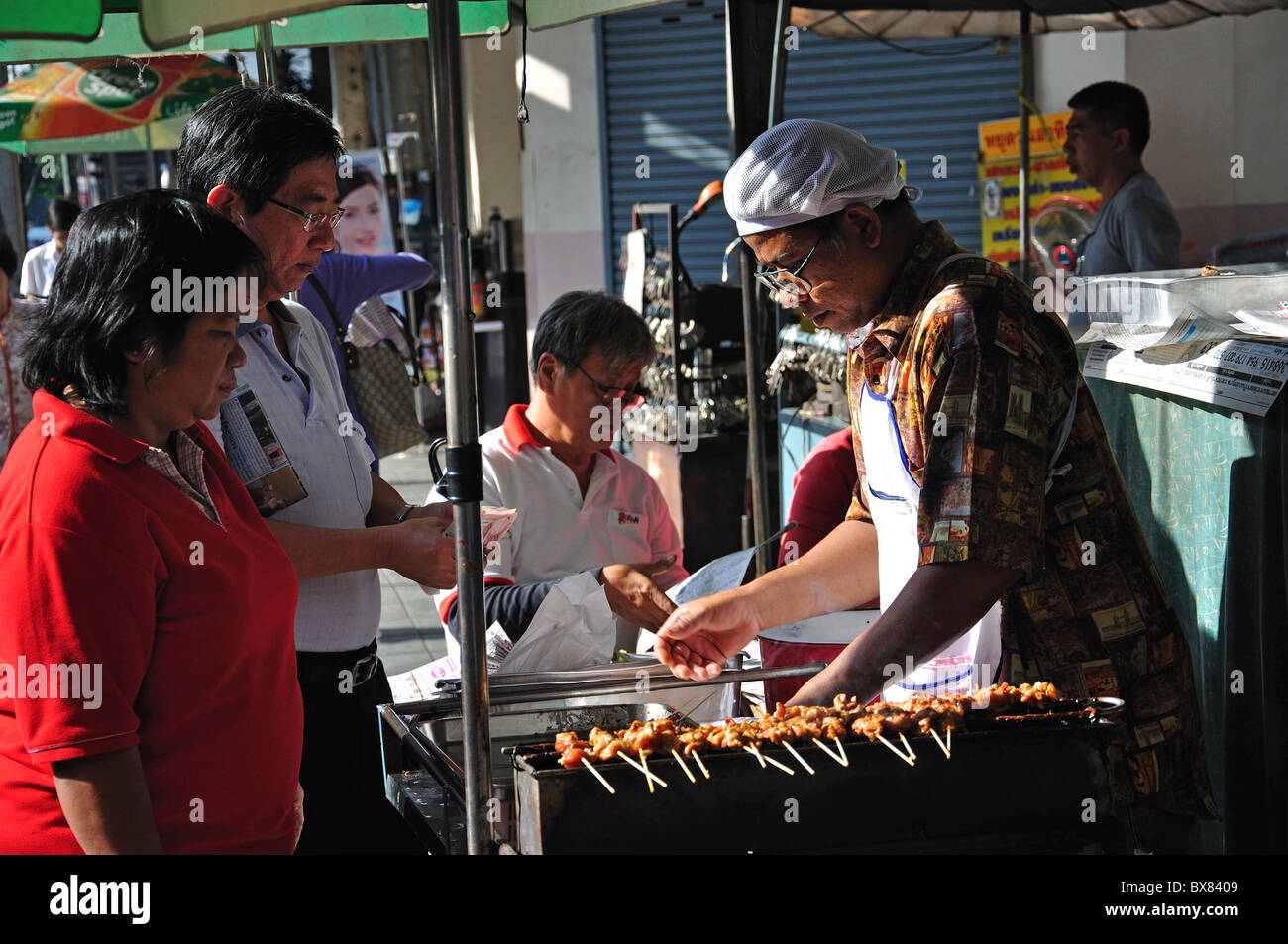 Cibo di strada, di stallo Silom, Bang Rak distretto, Bangkok, Thailandia Foto Stock