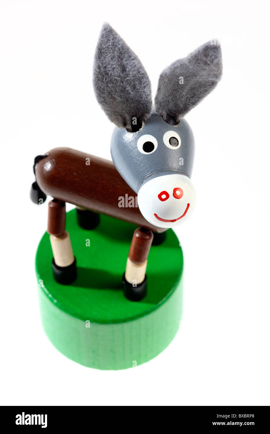 Giocattolo per bambini è un asino, annuendo asino, giocato da dita, si sposta su un verso il basso. Foto Stock