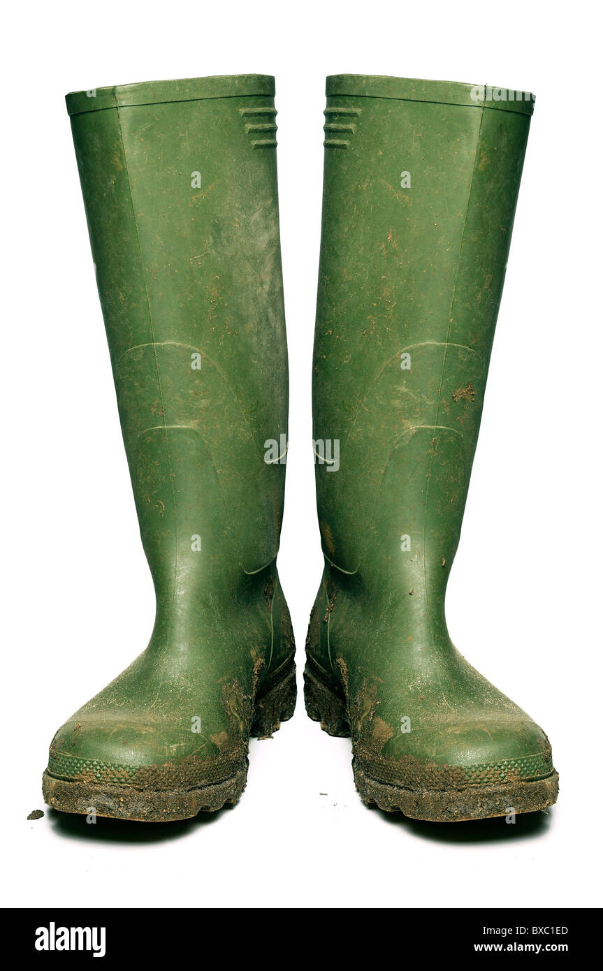 Stivali in gomma coperto di fango, tagliati fuori. Foto Stock