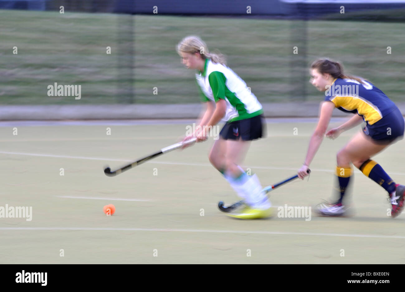 Donna hockey, azione blur Foto Stock