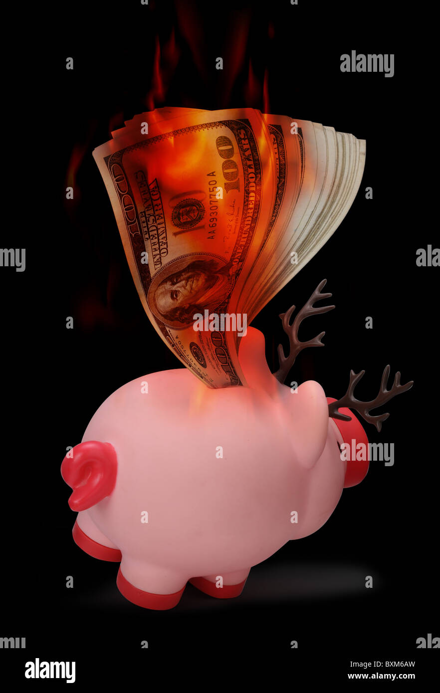 Salvadanaio sul fuoco. Foto Stock