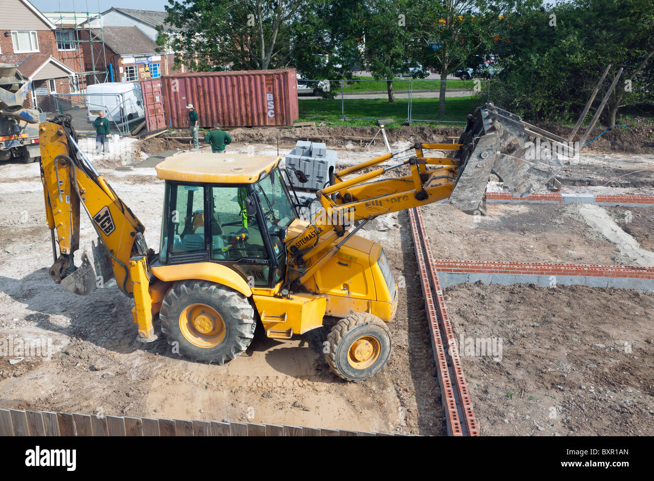 JCB Escavatore / Retroescavatore caricatore su un Regno Unito sito in costruzione Foto Stock