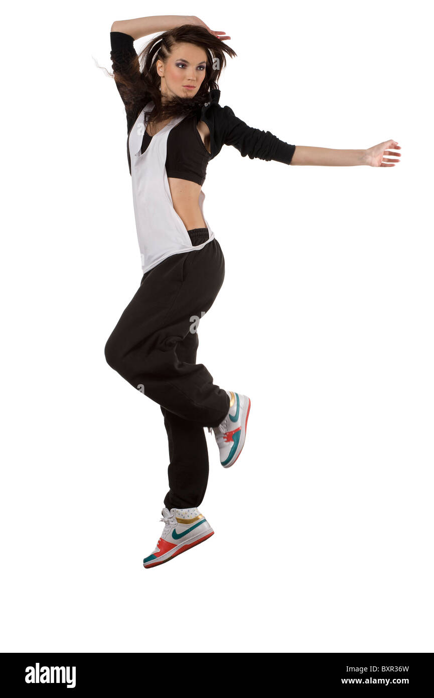 Moderna donna giovane ballerino in hip hop style saltando su sfondo bianco  e prendendo posizione Foto stock - Alamy