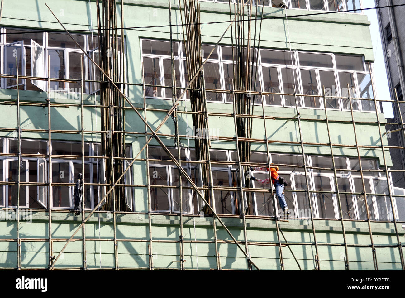 Il bambù ponteggi utilizzati in edilizia e costruzione di Hong Kong, Cina Foto Stock